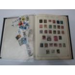 A stamp album containing World stamps including Great Britain penny black, India, Brazil, etc and