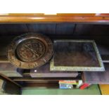 An oak dish decorated with floral carvings together with a bevel edged brass framed mirror, a/f,