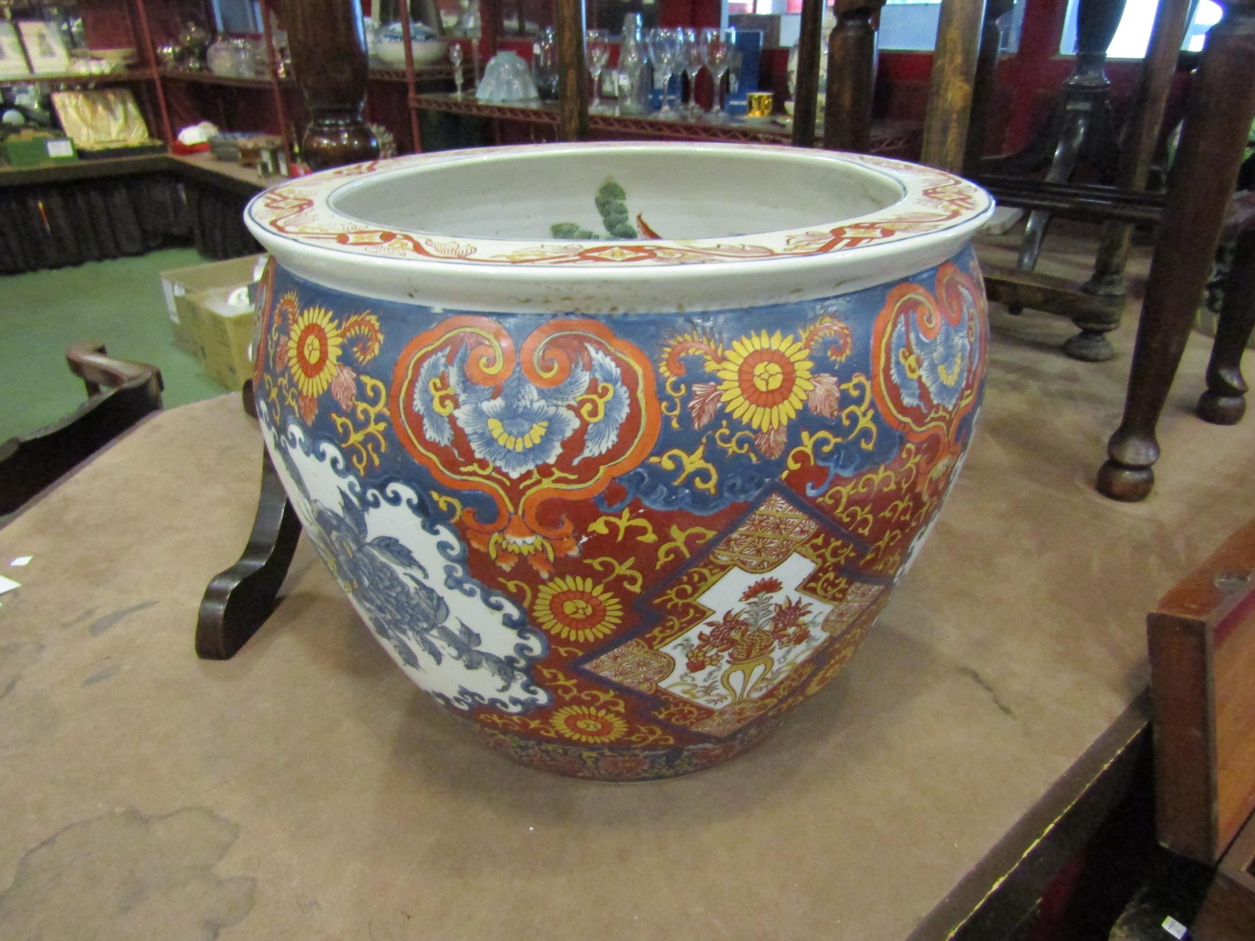 A Chinese jardiniere of large proportions with koi decoration to interior, 37cm diameter, 31cm tall