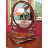 A Victorian mahogany oval swing mirror with jewellery compartment, 70cm x 57cm