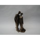 A modernistic form resin bronze of the happy couple