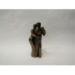 A modernistic form resin bronze couple, 20cm tall