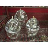 A set of three handmade heavy glass graduated egg shape oil burners, with spare wicks and oil funnel