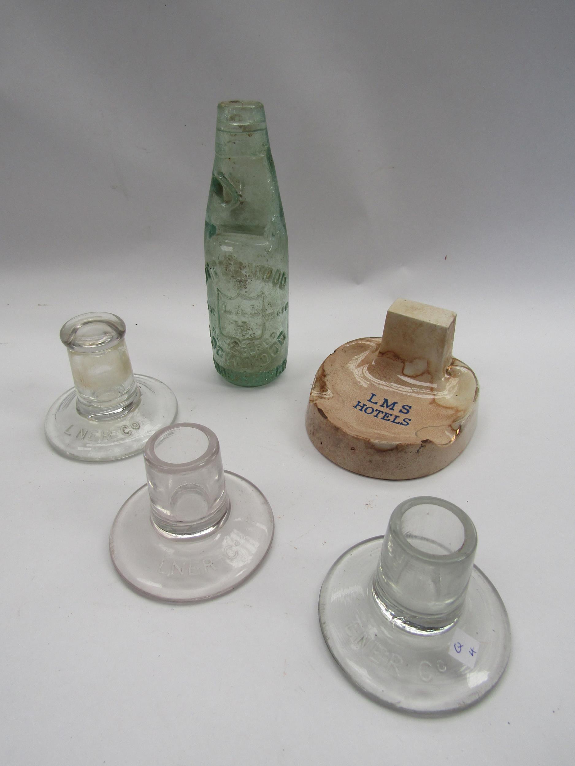 Three LNER candle holders codd bottle and an LMS ashtray (5)