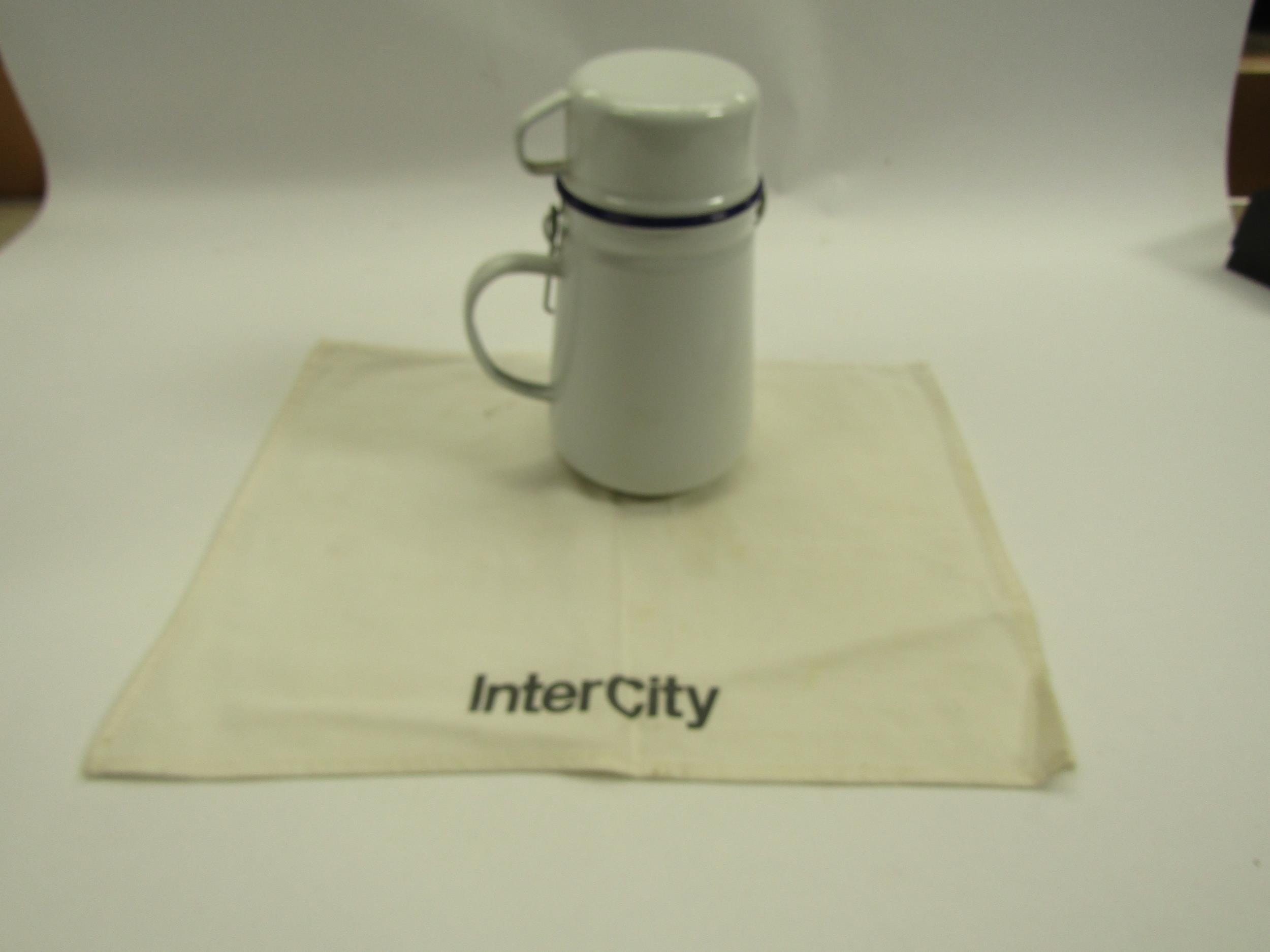 An engineman's enamel billy can and Intercity head cloth