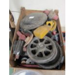 A box containing various wooden casting patterns including wheels, axle boxes, coupling rods,
