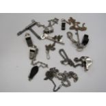A quantity of Acme whistles on chains, some keys and a carriage door key