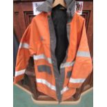 An orange hi-vis British Railways jacket, gillet and various ties etc