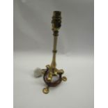 A brass Pullman style carriage table lamp on shaped tripod base with hole to one foot, 35cm tall