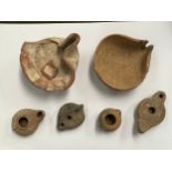 A collection of ancient lamps including Palestine provenance, one with 'early Israelite' archive