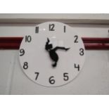 A Monty Python "Funny Walk" wall clock, 30cm diameter