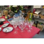 A set of six wine glasses with etched grape and vine detail and matching jug with stopper