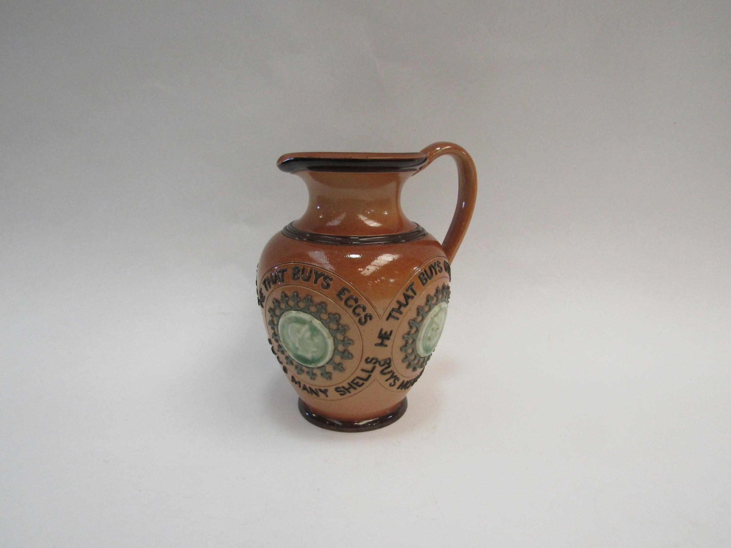 A Doulton Lambeth stoneware motto jug "He That Buys Land Buys Stone", "He That Buys Good Ale Buys