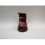 A cut glass ruby overlaid jug, 23cm tall