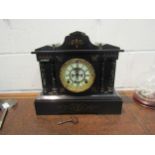 A late 19th Century black Belgian marble mantel clock of Architectural form with skeleton