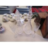 Two crystal glass decanters and a pair of champagne flutes (4)