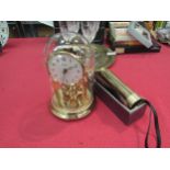 A brass 4 draw telescope 25 & 30mm. An anniversary clock with glass dome