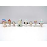 Eight glazed china heads including Pierrette
