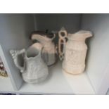 Three Victorian moulded stoneware jugs decorated in various Gothic/Medieval scenes (3) one with