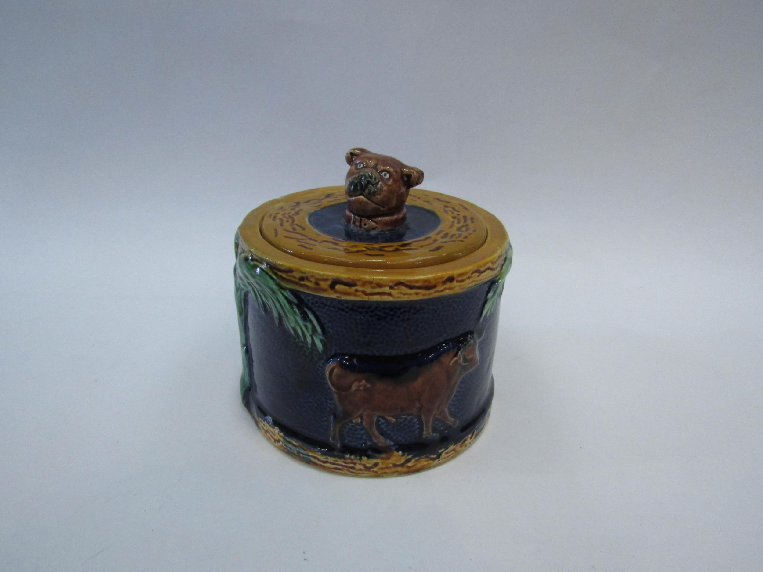 A 19th Century Majolica lidded pot with cattle detail, dog head finial. 11.5cm high