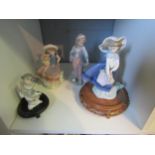 Three Lladro figures including flower carriers and one other similar