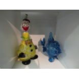 A Murano decanter as a clown and a blue glass figure of a fish (2)