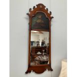 A reproduction fretwork wall mirror with hand painted floral panel, 106.5cm tall