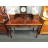 A late Victorian/Edwardian mahogany Mansion House desk with fitted structure of drawers, cupboard