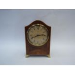 A mantel timepiece with Roman numeral dial. 17.5cm high