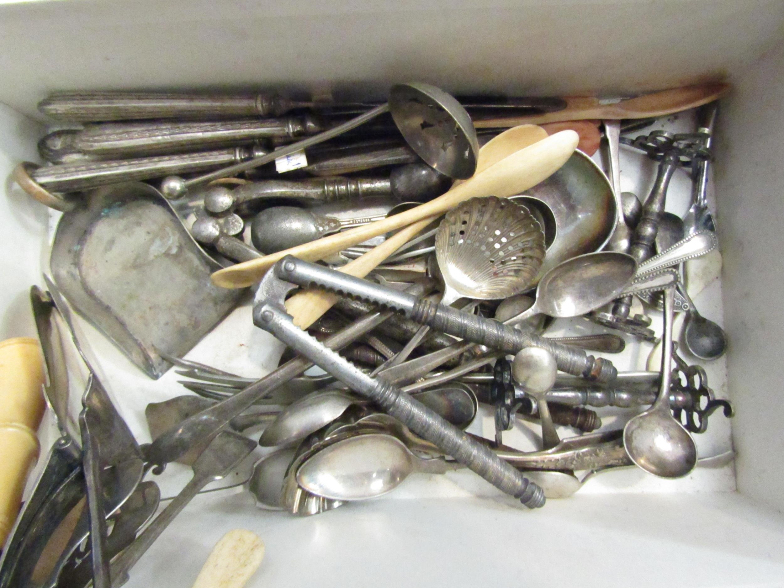 A box of plated wares including sugar tongs, scoop, salt spoons etc also bone spoons and silver - Image 2 of 2