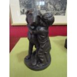 A Heredities cold cast bronze figure of a boy hugging dog, 17cm tall