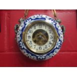 A French hanging wall clock by Eugene Farcot, ca. 1890. Circular porcelain case with blue decoration