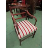 A 19th Century carver chair with spindle back, red silk stripe seat