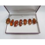 An amber seven panel bracelet