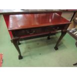 A 19th Century mahogany side table the two frieze drawers over cabriole legs on ball in claw feet.