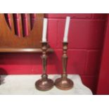 A pair of 19th Century copper candlesticks, 29cm high