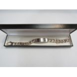 A silver heavy link identity bracelet, vacant panel