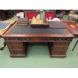 Circa 1860 a mahogany twin pedestal partners desk of twelve drawers and two single door cupboards on