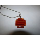 A large agate pendant hung on chain