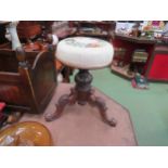 A Victorian mahogany revolving piano stool with carved cabriole legs, needlepoint tapestry seat