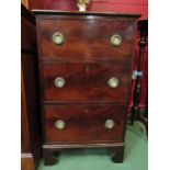 A small mahogany chest of three drawers on bracket feet, with brass ring handles. 89cm x 53cm x 51cm