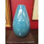 A turquoise blue glass vase with black line detail, 28cm high
