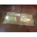 An Oriental oblong brass tray etched with traditional garden scene, 37cm long