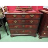 A George III flame mahogany chest of four graduating drawers with pierced brass back plate and