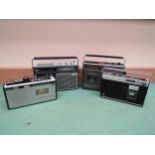 Four 1970's/1980's portable radio cassette recorders to include Pye 9014, Sharp GF 1754, Sanyo 2000G