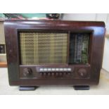 A Marconi Marconiphone model 882 table top valve radio in wooden case with Bakelite knobs, push
