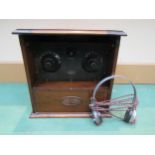 A W.G. Pye model 720 two valve radio, housed in walnut cabinet with paper instructions attached to