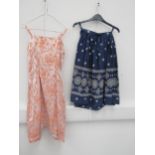 A navy and white pattern cotton skirt and a peach pattern day dress