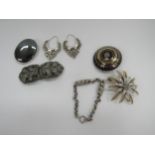 Four brooches including a pique tortoiseshell circular brooch, a silver link bracelet, a pair of