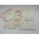 A small selection of early to mid 20th Century baby's clothing including a 1950's home made party